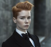 Short red hairdo with a modish style