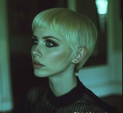 Short blonde hair reflects simple elegance