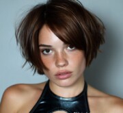 A chic, polished short brown style with a sharp edge