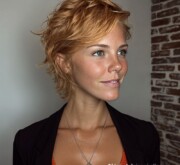 A fiery short red hairdo, radiant with shine