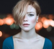 A fresh short red hairdo, glowing like fire