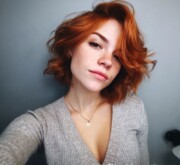 A short red style, glowing with happiness