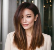 Long brown coif with sleek texture for smooth movement Long brown coif with sleek texture for smooth movement