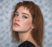 Medium length red hair glowing with fiery passion Medium length red hair glowing with fiery passion