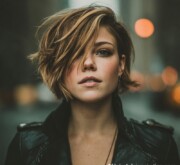 Short blonde female cut with sharp, sleek lines