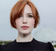 Short red hairdo, radiant and fresh