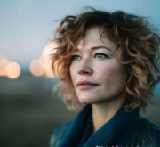 Short red hairdo, radiant with color