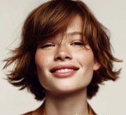 Trendy short brown hairdo with a light, bouncy finish